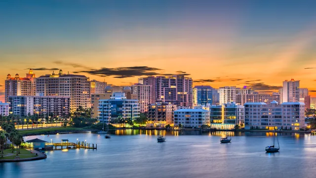 Waterfront skyline with boats on the water at sunset in Florida.