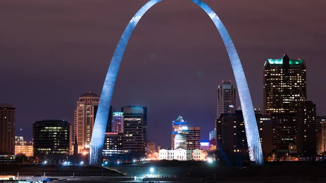 The Gateway Arch and the downtown skyline at night in St. Louis, Missouri.